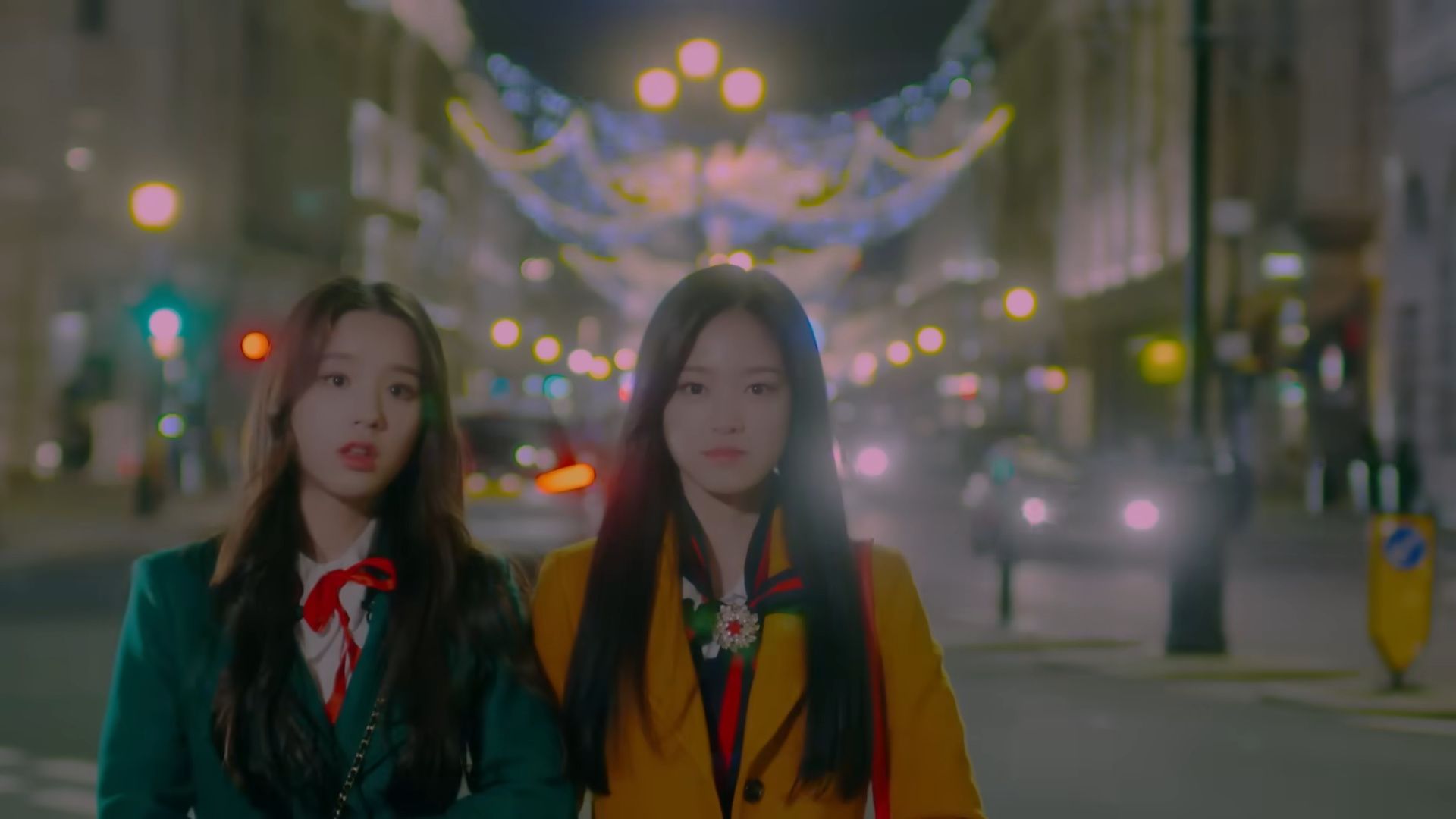 Heejin and Hyunjin looking at the viewer.